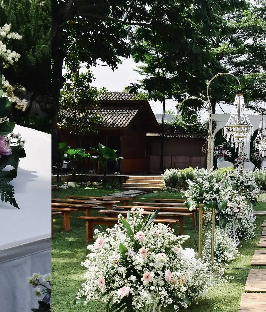 Dekorasi bunga pernikahan ditata di antara pepohonan taman